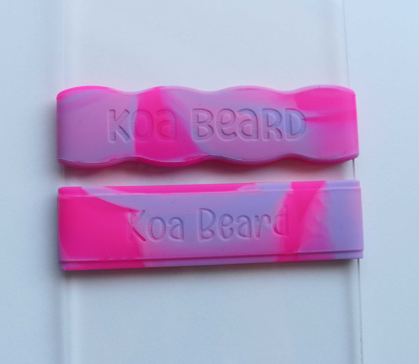 Close-up of engraved name on tie-dye bottle band