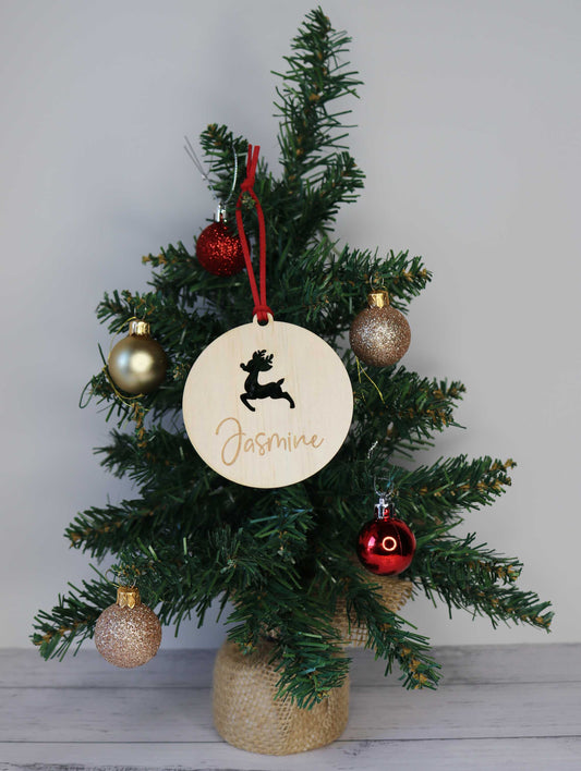 Personalised reindeer bauble hanging on Christmas tree