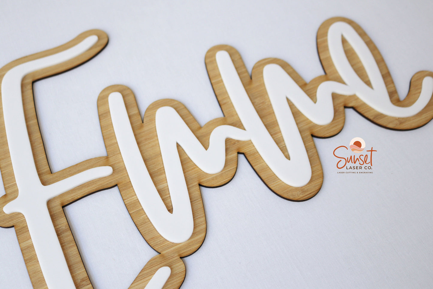 Hanging personalised wooden name sign on wall