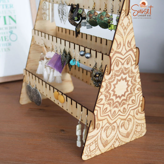 Wooden mandala earring stand with slots for dangles and studs close up of mandala engraving