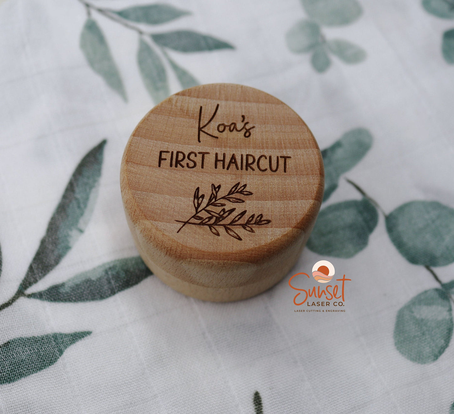 Engraved first haircut box displayed on white background
