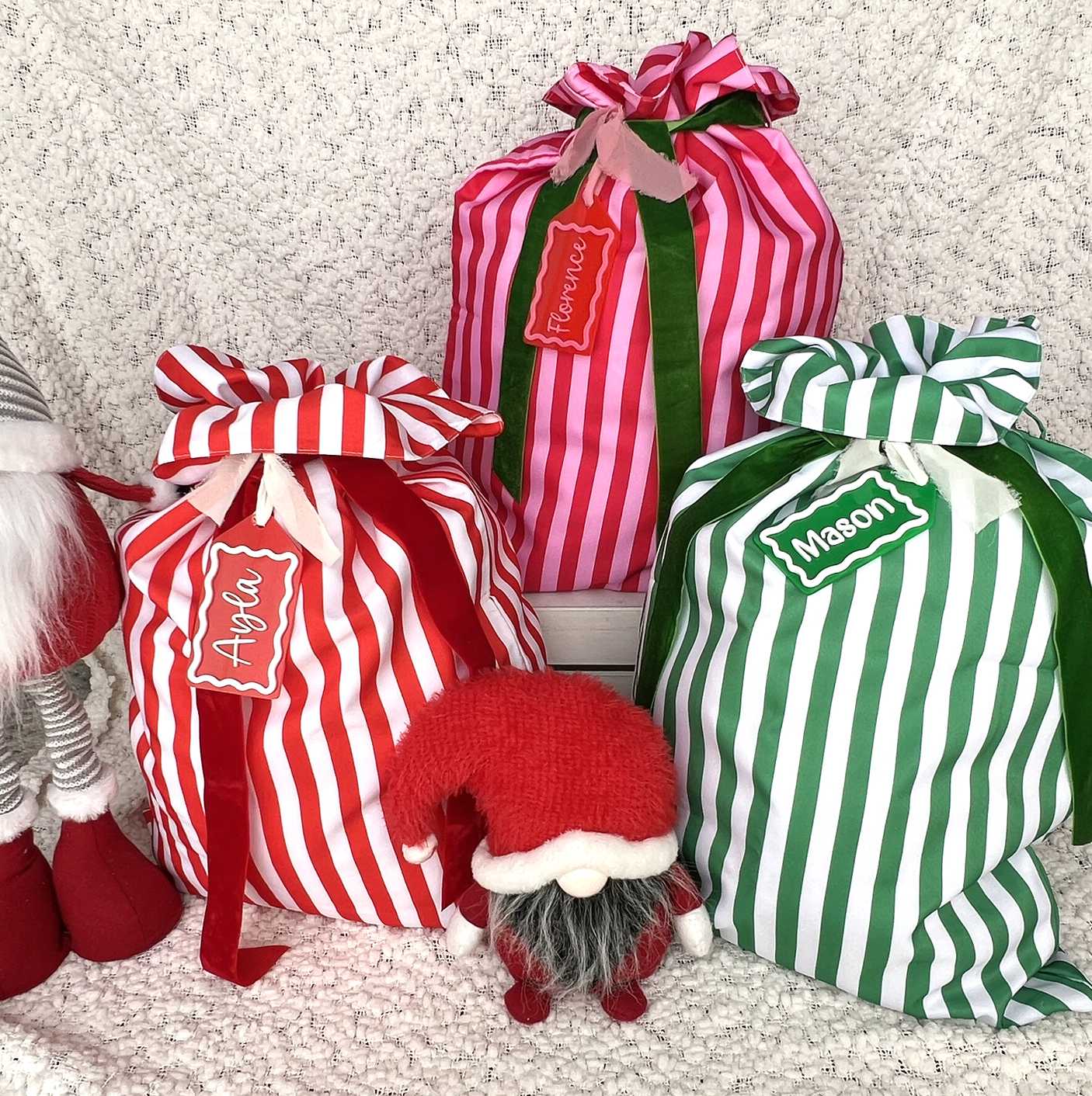 Stipe Christmas Santa Sacks in Red and White, Red and Pink and Green & White with matching custom acrylic name tags
