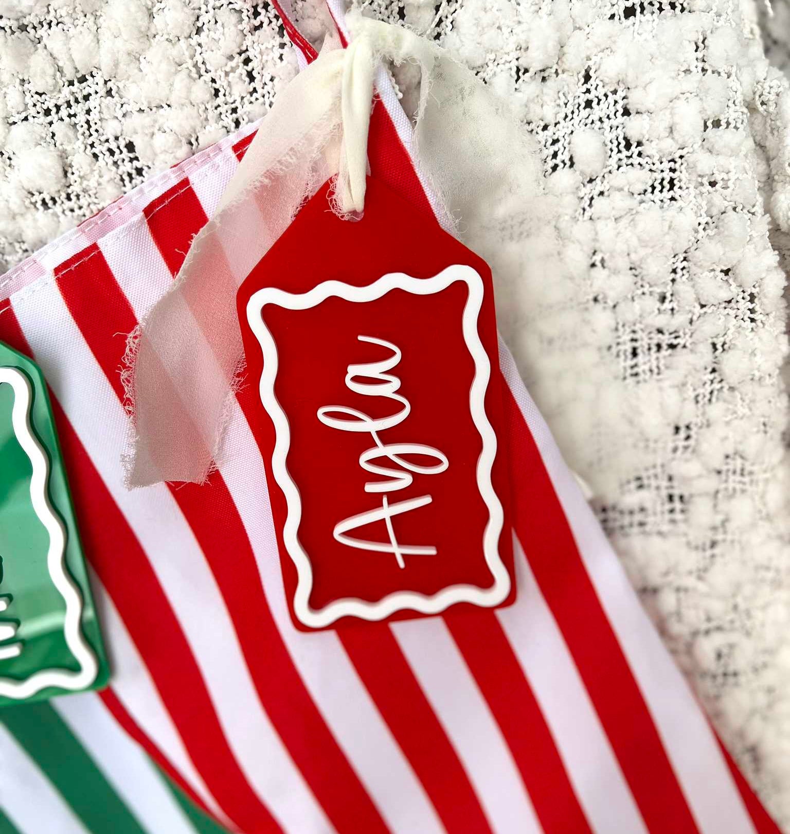 Red and White Candy Cane Stripe Christmas Stocking with Matching Custom Acrylic Name Tag