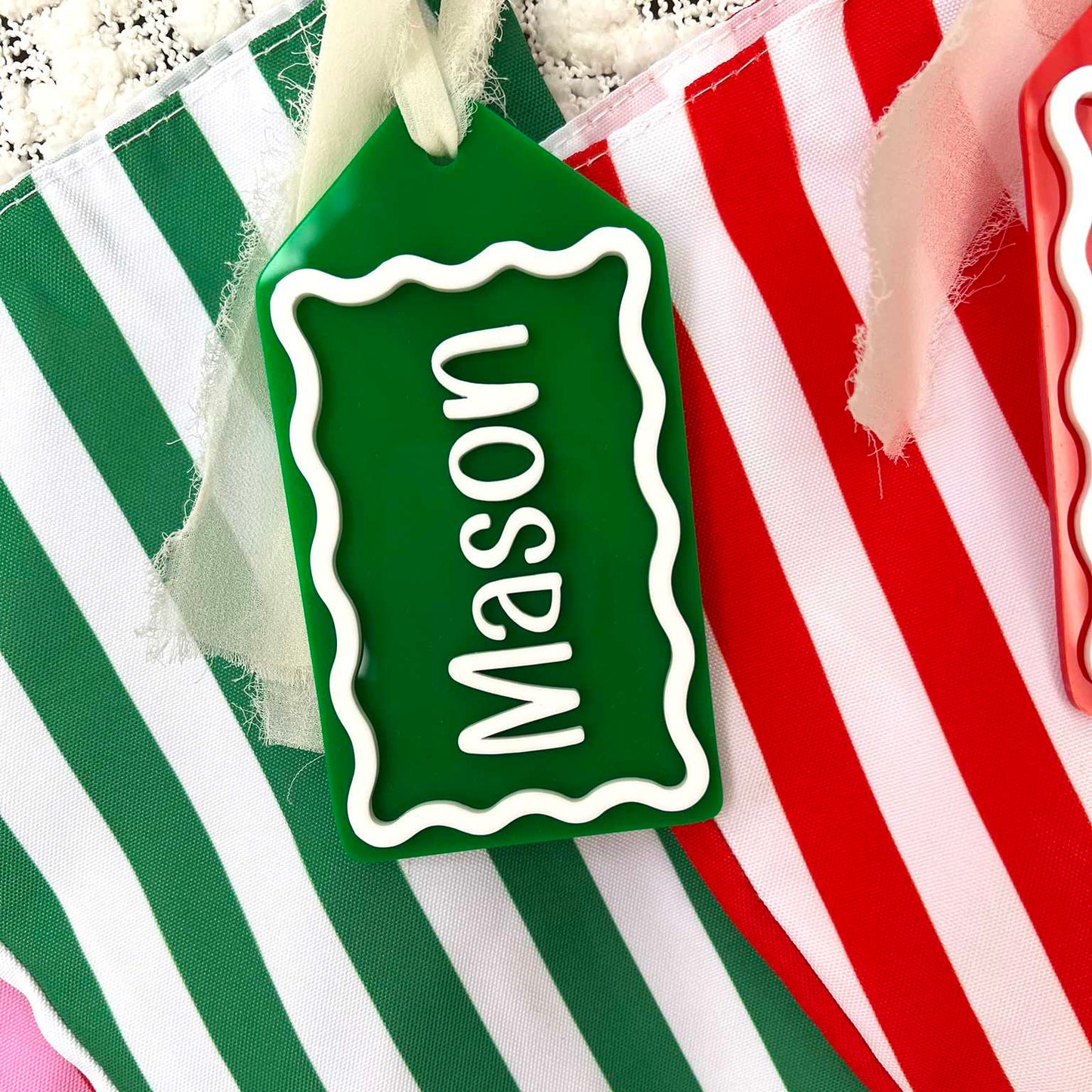 Green and white stripe christmas stocking with matching custom acrylic gift tag
