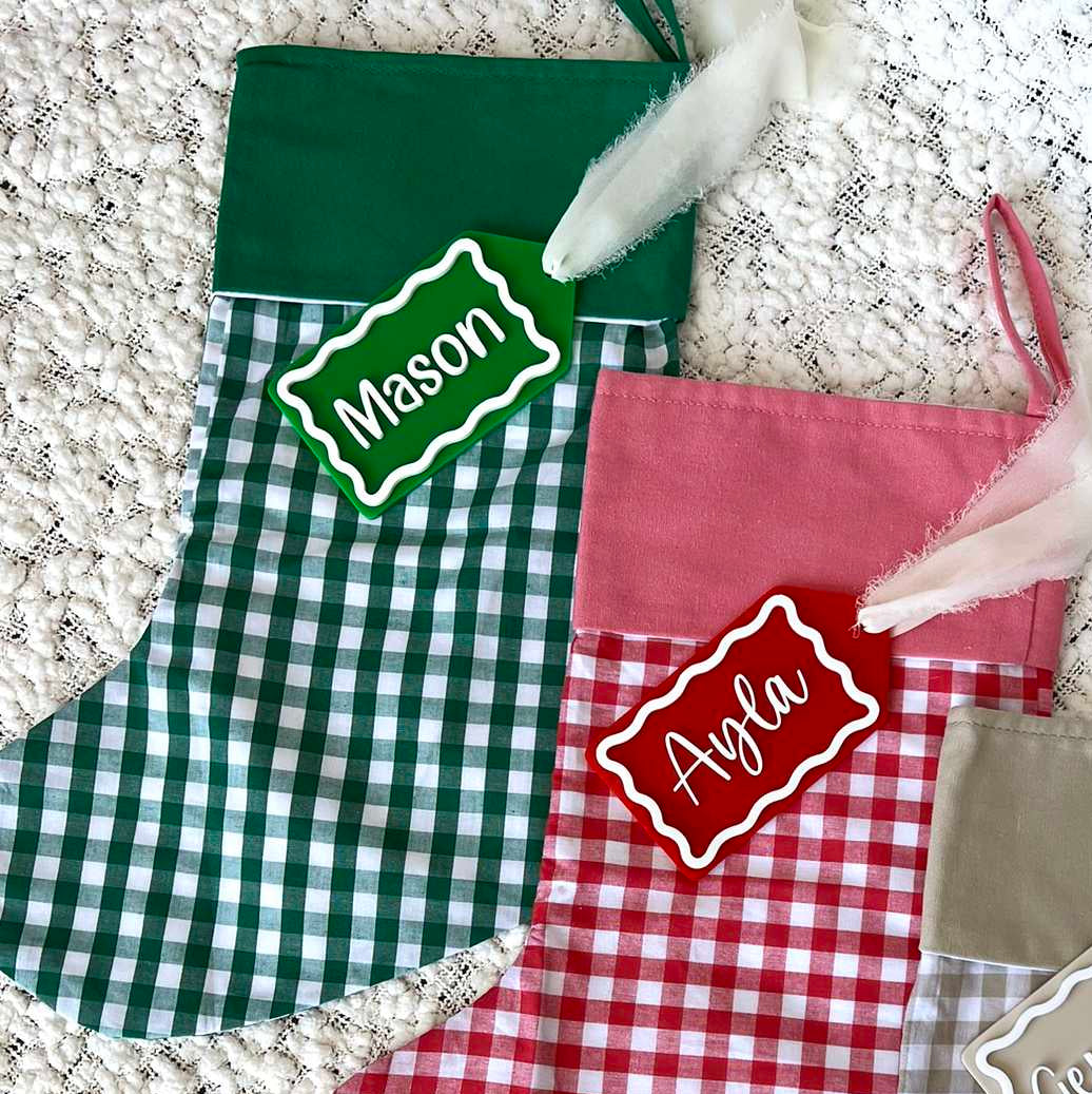 Green Gingham Christmas Stocking with Green Solid Colour Cuff shown with Green and White Custom Name Tag
