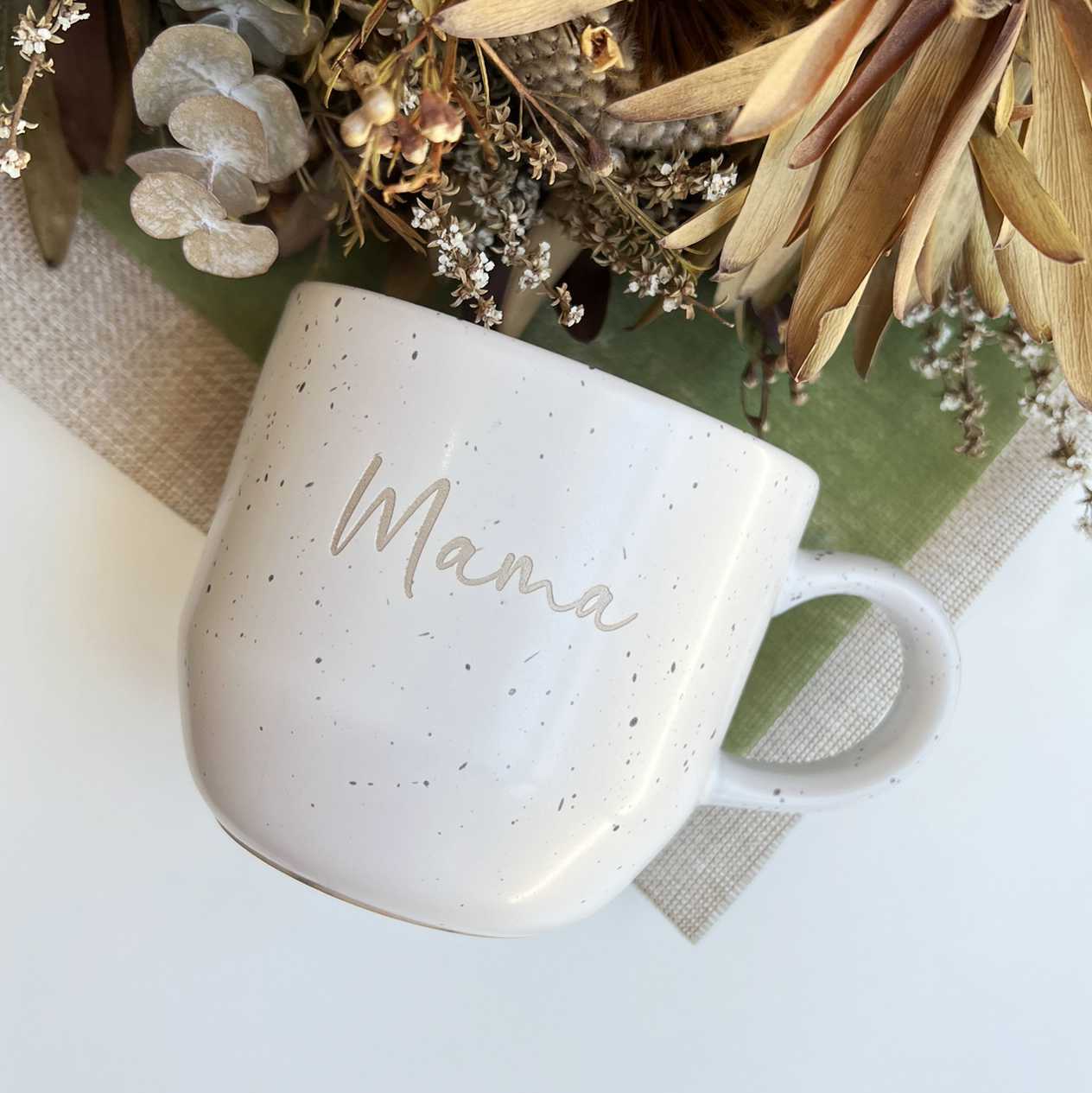 Top view of speckled ceramic mug with laser engraving