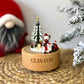 Custom laser engraved round wooden musical christmas train carousel with name Clinton in bold font