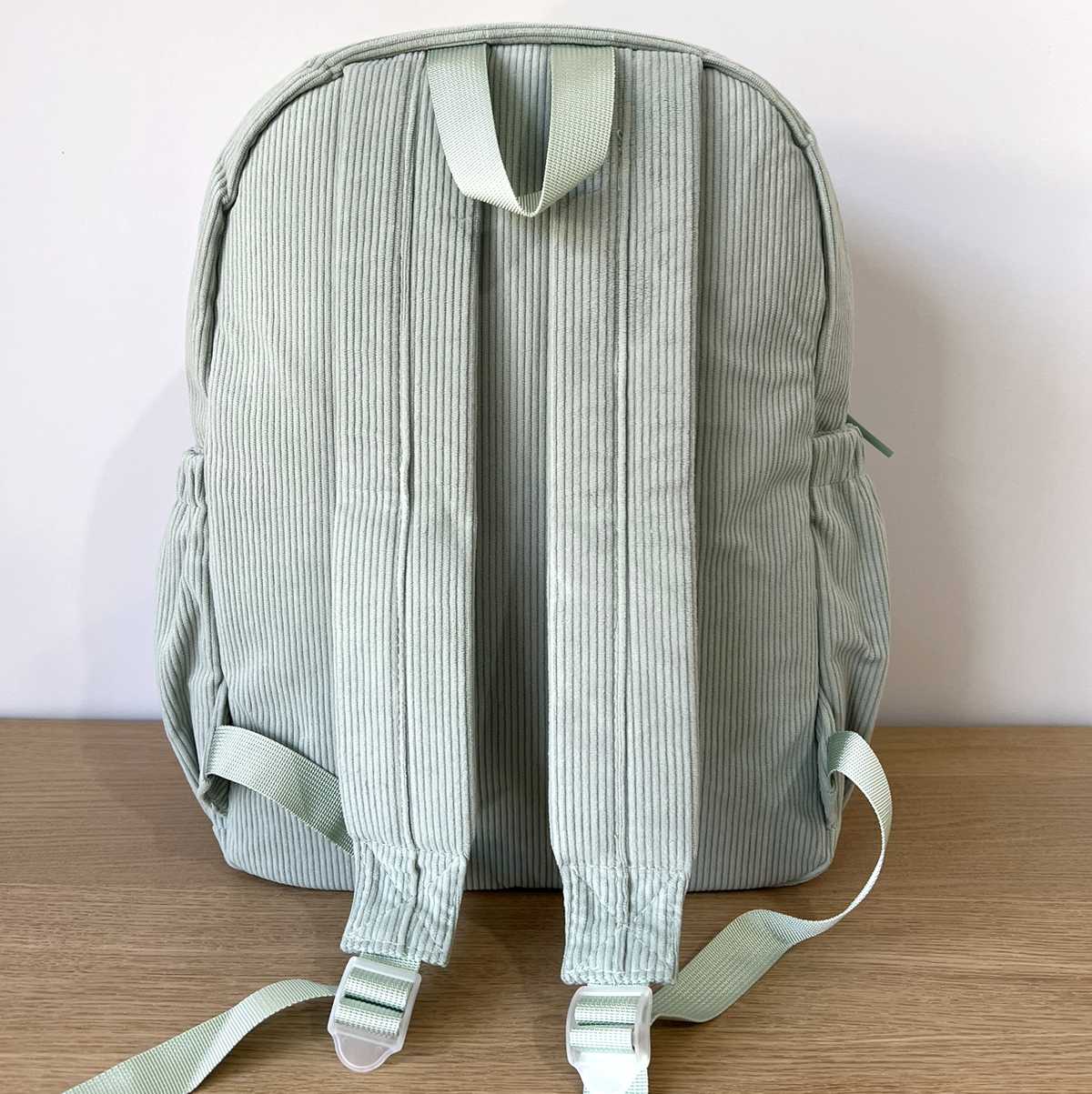 Large Green Corduroy Backpack Back View showing shoulder straps and back of bag.
