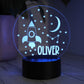 Custom Kids Night Light with Space Design and Rocket Ship shown with Blue LED light on and personalised with Oliver name