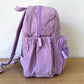Purple Corduroy Backpack Side View showing Side Pocket and Custom Zips