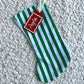 Green and White Stripe Christmas Stocking with Red and White Custom Acrylic Name Tag