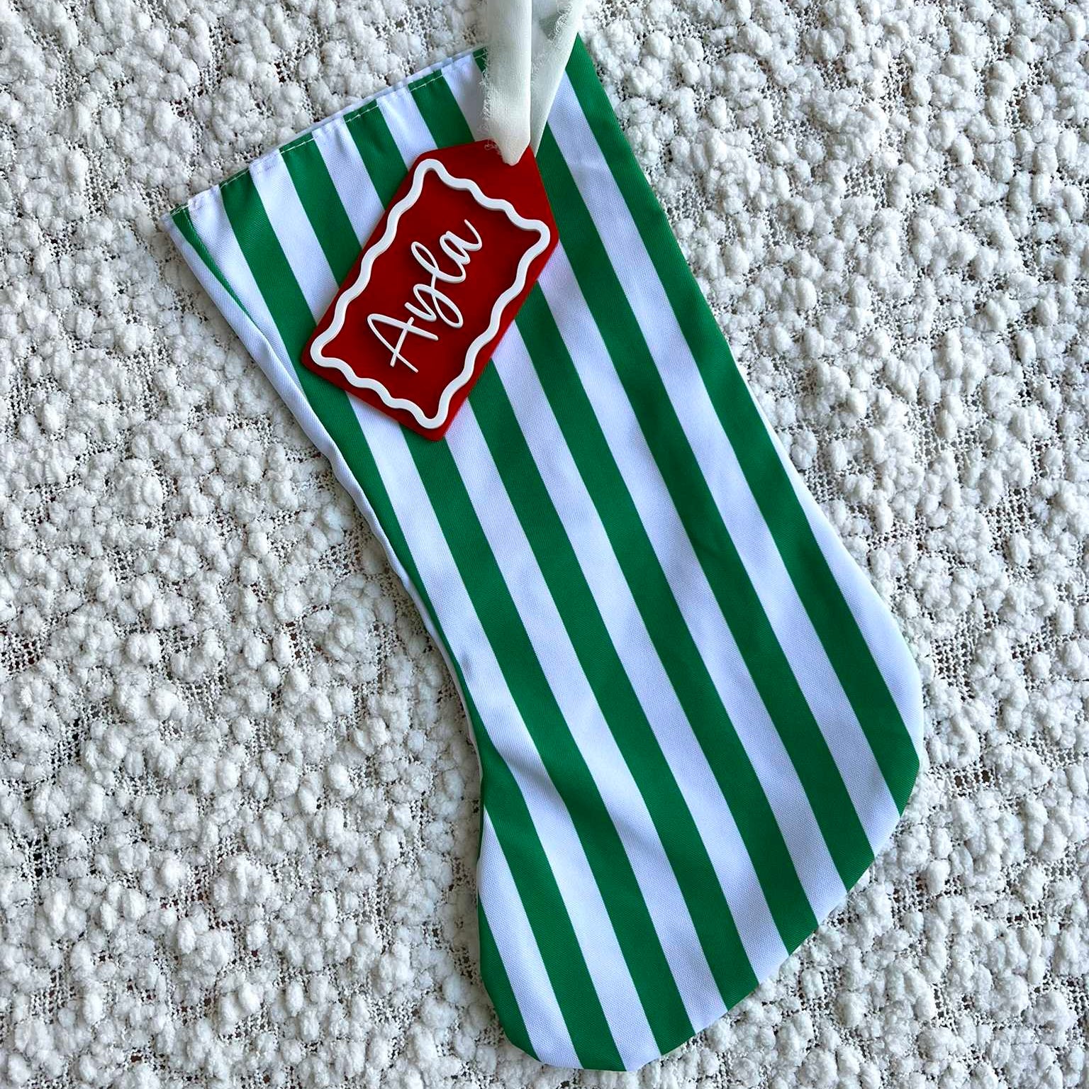 Green and White Stripe Christmas Stocking with Red and White Custom Acrylic Name Tag