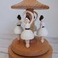 Wooden music box with ballerina figurines on a white background