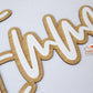 Hanging personalised wooden name sign on wall