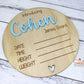 Close-up of engraved baby name on wooden plaque